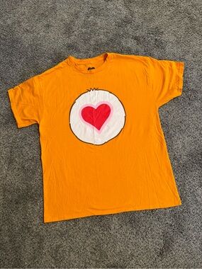 Care Bears Orange Tee with Pink Heart Badge